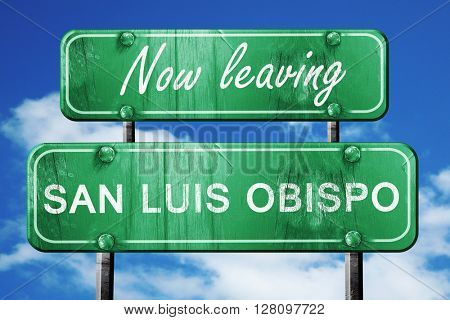 Leaving san luis obispo, green vintage road sign with rough lett
