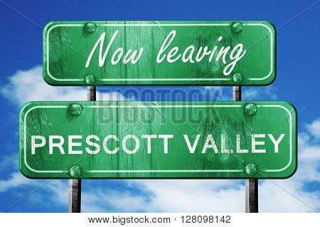 Leaving prescott valley, green vintage road sign with rough lett