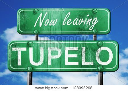 Leaving tupelo, green vintage road sign with rough lettering