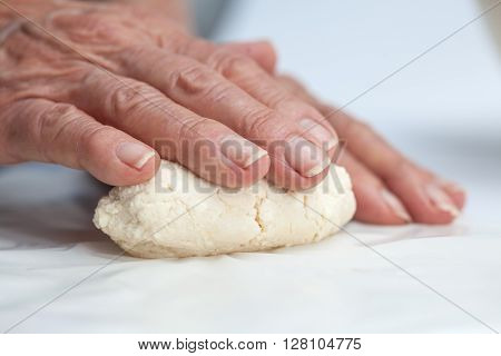 Cassava bread preparation : shaping colombian cassava bread (Pandeyuca)
