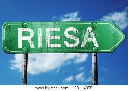 Riesa road sign, 3D rendering, vintage green with clouds backgro