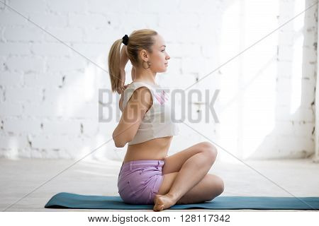 Happy Girl Sitting In Cow Face Pose