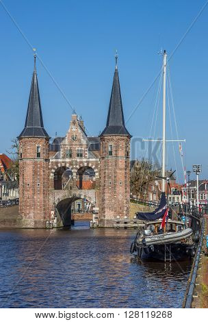 SNEEK, NETHERLANDS - APRIL 11, 2016: Water gate and ship in the historical city Sneek, Netherlands