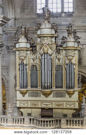 Jaen, Spain - may 2016 2: Monumental main organ inside the choir is one of the biggest of Spain, The organ this insert in baroque structure, is the work of Jose Garcia and Manuel Lopez (1870), Jaen, Spain