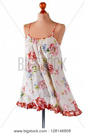 Casual floral pattern sarafan. Vintage sarafan on armless mannequin. Woman's light summer clothing. Garment of lightweight material.
