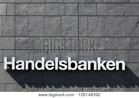 Aarhus, Denmark - May 1, 2016: Handelsbanken logo on a wall. Handelsbanken is a Swedish bank providing universal banking services and it is one of the major banks in Sweden with over 460 branches.
