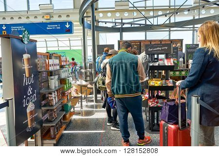CHICAGO, IL - CIRCA APRIL, 2016: Starbucks Cafe at O'Hare Airport. Starbucks Corporation is an American global coffee company and coffeehouse chain based in Seattle, Washington