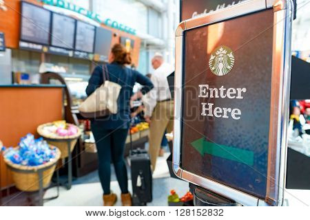CHICAGO, IL - CIRCA APRIL, 2016: Starbucks Cafe at O'Hare Airport. Starbucks Corporation is an American global coffee company and coffeehouse chain based in Seattle, Washington