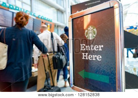 CHICAGO, IL - CIRCA APRIL, 2016: Starbucks Cafe at O'Hare Airport. Starbucks Corporation is an American global coffee company and coffeehouse chain based in Seattle, Washington