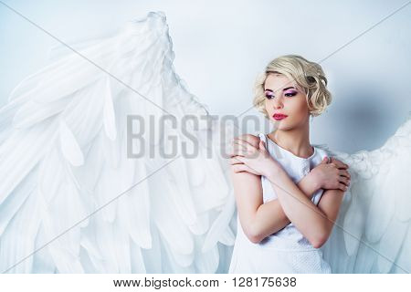 beautiful model with makeup and angel wings