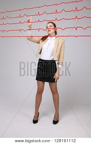 Doctor woman working with cardiogram lines
