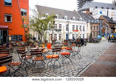 Aachen, Germany - April 13 : Tourists on foot Street in Aachen, Germany. Aachen was a residence of Charlemagne, and later the coronation place for German kings. April 13, 2016 in Aachen, Germany