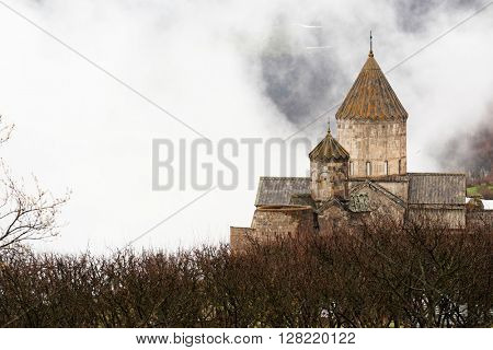 Ancient monastery Tatev covered with clouds in the mountains of Armenia. Was founded in year 906. 