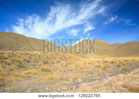 landscape of dry mountain range at Lindis Pass, the highest highway, in NewZealand