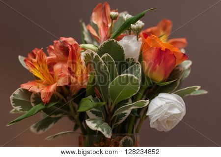 Brides bouquet with colorful flowers on wedding day.