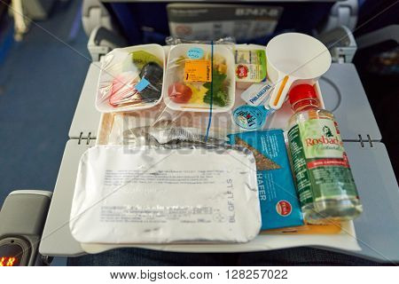 FRANKFURT, GERMANY - MARCH 13, 2016: close up shot of meal at Lufthansa Boeing 747-8 economy class.  Deutsche Lufthansa AG, commonly known as Lufthansa is a major German airline.
