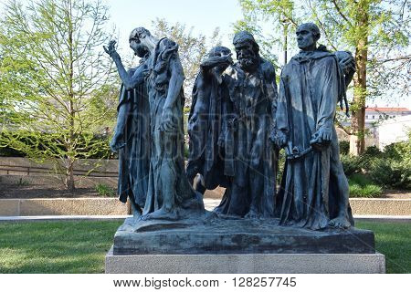 WASHINGTON, DC - APR 16: Les Bourgeois de Calais sculpture by Auguste Rodin at the Hirshhorn Sculpture Garden in Washington, DC, on April 16, 2016. In 2013, the Sculpture Garden drew 645,000 visitors.