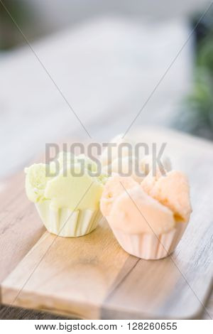 Cotton - wool cake on wooden thai dessert thai steamed cupcakes muffin cup cake or cotton-wool cake