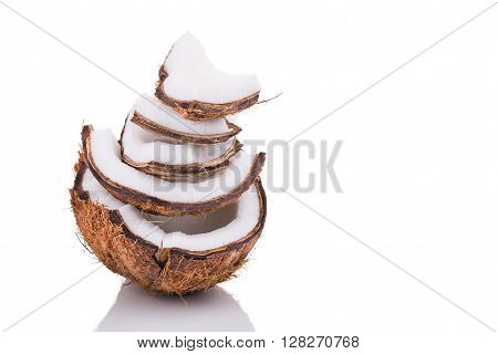 Old Brown Organic Coconut Fruit Broken Into Pieces And Stacked