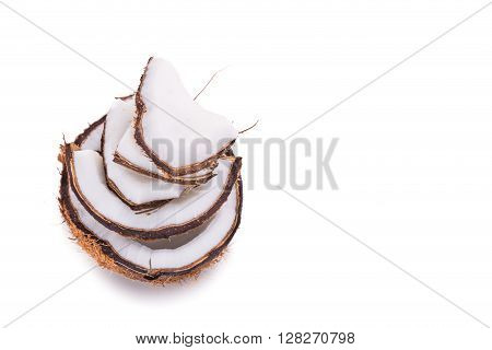 Old Brown Organic Coconut Fruit Broken Into Pieces And Stacked