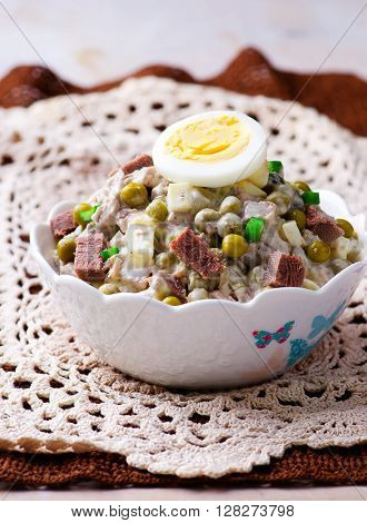 salad with veal tonque and mayonnaise. selective focus