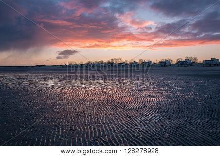 Dawn and holiday houses on the bay.