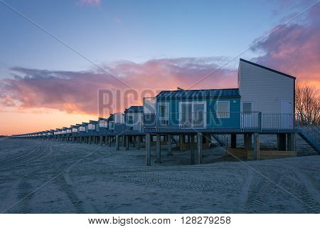 Dawn and holiday houses on the bay.