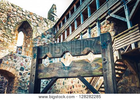 Wooden Medieval Torture Device, Ancient Pillory In Old Castle.