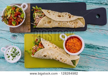 Tortilla with pulled pork, fresh vegetables
