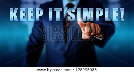 Business coach is pressing KEEP IT SIMPLE! on a virtual touch screen interface. Call to action motivational appeal and business concept for a straight-forward tactical approach to management.