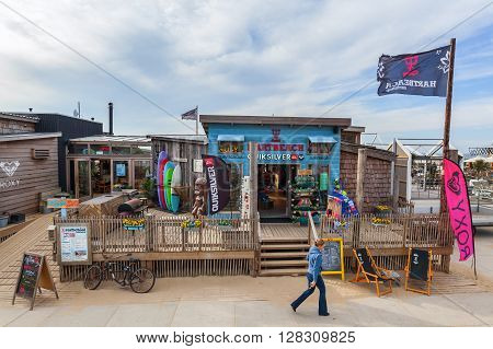 Scheveningen Netherlands - April 21 2016: beach bar in Scheveningen with unidentified people. From a small fishing village Scheveningen developed to the largest seaside resort i Netherlands
