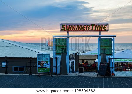 Scheveningen Netherlands - April 21 2016: beach bar in Scheveningen with unidentified people. From a small fishing village Scheveningen developed to the largest seaside resort i Netherlands