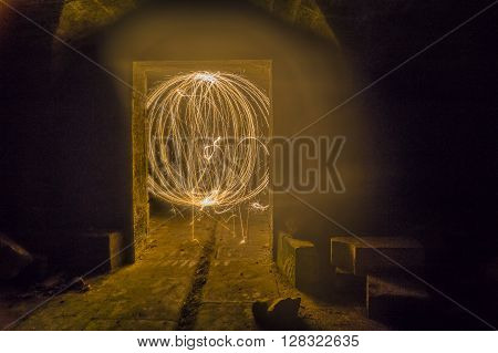 Dungeon fireball created with sparklers in ruined building