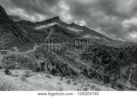 Beautiful famous curvy roads on Old Silk Route Silk trading route between China and India Sikkim black and white image