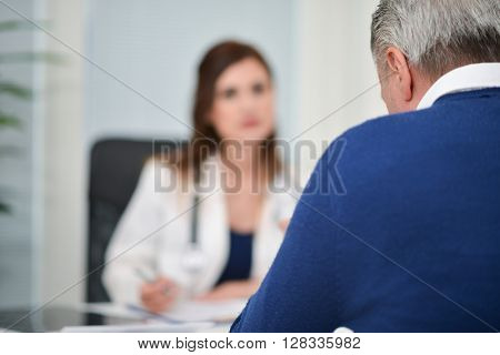 Patient talking to his doctor during a visit