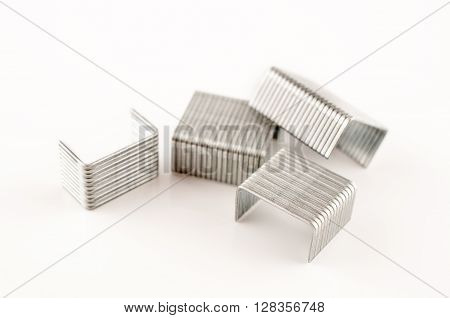 Four small staple stapler in white background