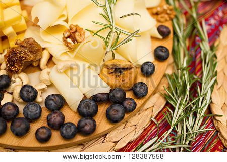 Still life photo with Georgian cheese apple grape fig