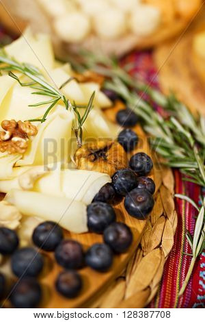 Still life photo with Georgian cheese apple grape fig