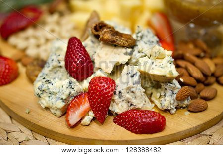 Still life photo with Georgian cheese fig grape almonds
