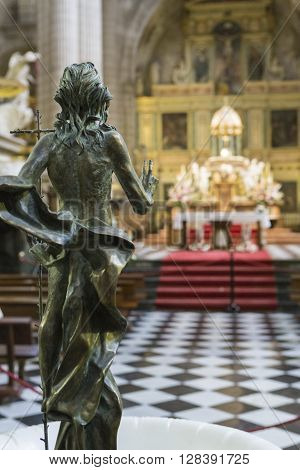 Jaen - Spain, may 2016, 2: Sculpture of risen Jesus made in bronze, located at the entrance of the baptistery in the entrance area to the choir stalls, opposite the high altar of the Cathedral, take in Jaen, Spain