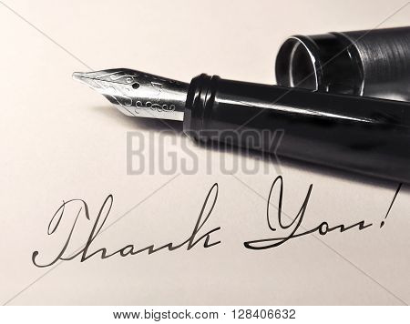thank you writing and fountain pen on paper