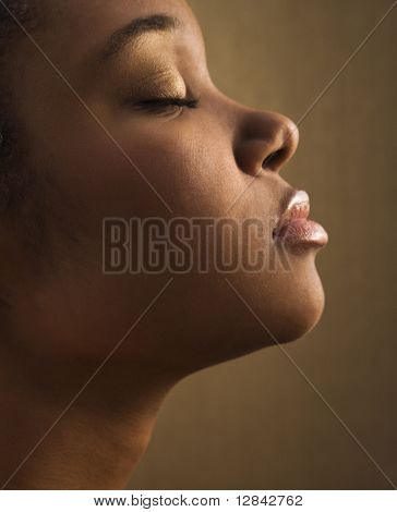 Serene portrait of young adult African-American female's face.