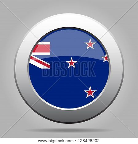 metal button with the national flag of New Zealand on a gray background