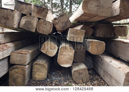 Wooden beams. Perspective composition with long beams. Exterior scene with building material. Roof building wooden components. Carpentery beam.