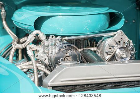 chrome and turquoise engine bay on a high performance vehicle