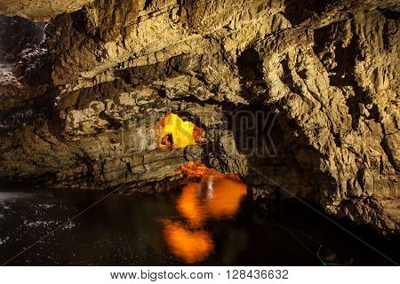 lights in Smoo Cave in the highlands of Scotland