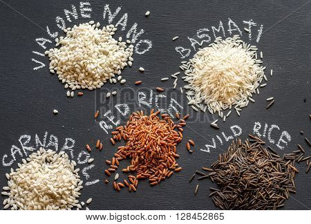Different Kinds Of Rice On The Dark Background
