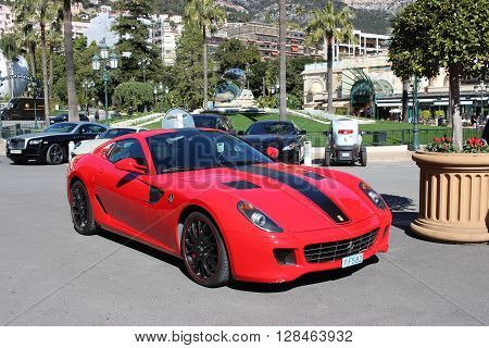 Monte-Carlo Monaco - March 9 2016: Red Ferrari 430 Scuderia Parked in Front of the Monte-Carlo Casino in Monaco