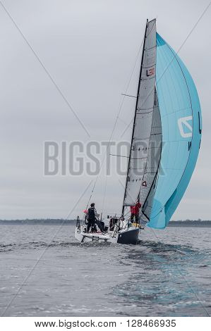 KYIV, UKRAINE - APRIL 26, 2016: Traning on the new model of yacht OceanTECH L30 on the Kyiv water reservoir or Kyiv SEA with Rodion Luka, L30 idea author, Silver Olympic medalist.