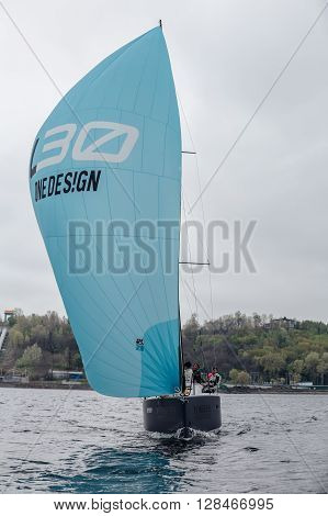 KYIV, UKRAINE - APRIL 26, 2016: Traning on the new model of yacht OceanTECH L30 on the Kyiv water reservoir or Kyiv SEA with Rodion Luka, L30 idea author, Silver Olympic medalist.